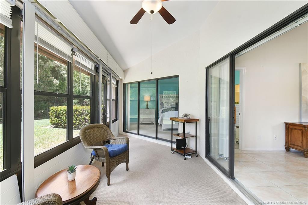 3401 Southeast Martinique Trace, Unit 101 Stuart, FL 34997 - Photo 20 of 51 a living room with furniture and a large window