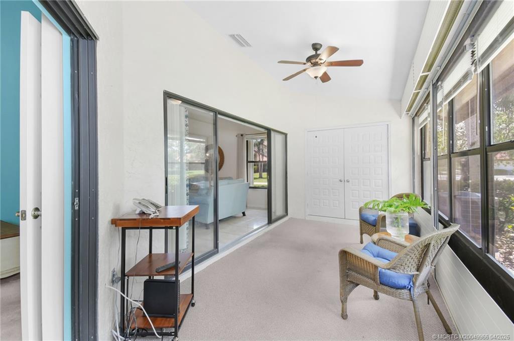 3401 Southeast Martinique Trace, Unit 101 Stuart, FL 34997 - Photo 23 of 51 a living room with furniture and a window