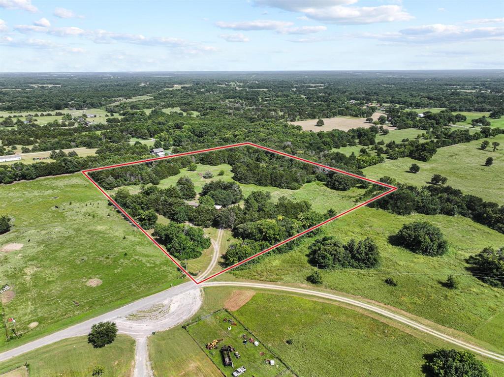 252 Meadow Lake Estates Road Denison, TX 75021 - Photo 30 of 37 Expansive land parcel featuring a mix of open grassy areas and mature tree coverage