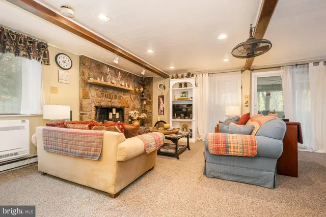 a living room with lots of furniture and lots of furniture