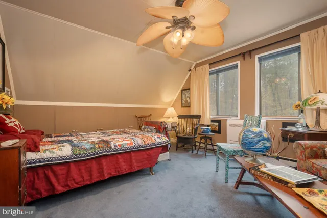 a bed room with a bed and a chandelier