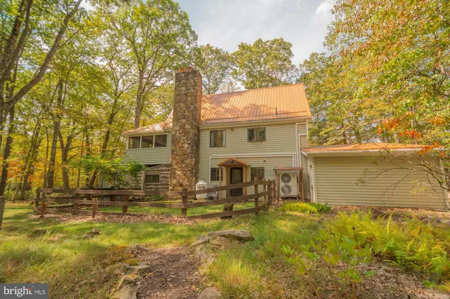 a front view of a house with swimming pool