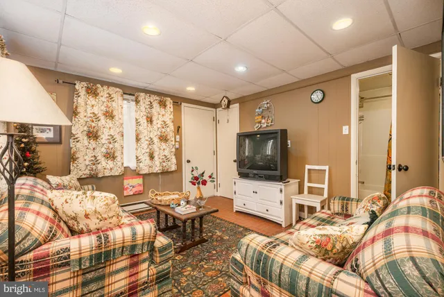 a bathroom with a toilet sink and shower curtain