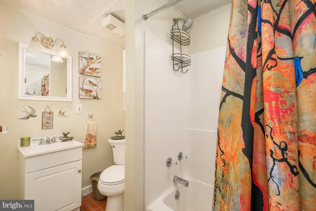 a room with furniture pool table and windows