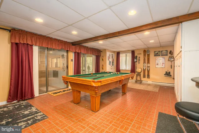 a dining room filled with furniture and a chandelier