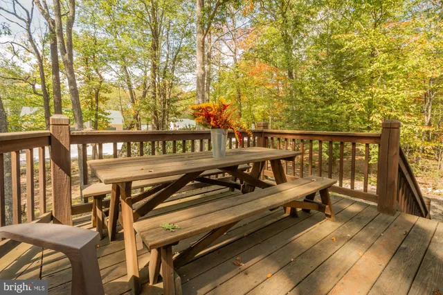 a view of a chairs and table in the balcony