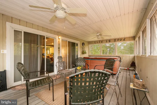 a bedroom with furniture window and wooden floor