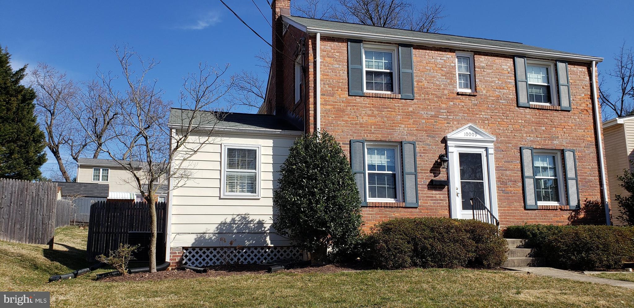 10009 Raynor Road Silver Spring, MD 20901 - Photo 2 of 34 a view of a house with large windows and a yard