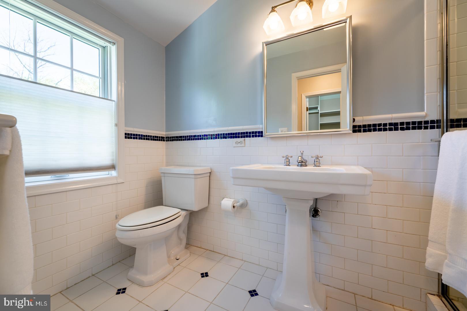 10009 Raynor Road Silver Spring, MD 20901 - Photo 16 of 34 a bathroom with a sink toilet and mirror