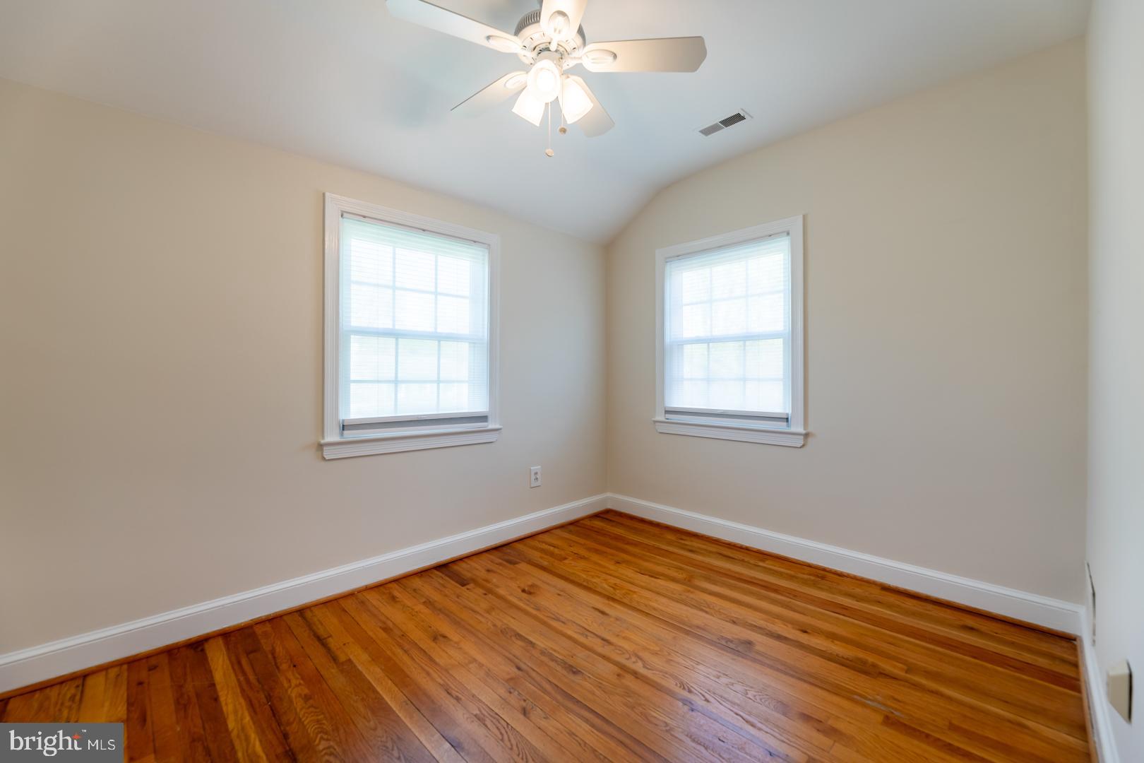 10009 Raynor Road Silver Spring, MD 20901 - Photo 18 of 34 a view of empty room with wooden floor and fan
