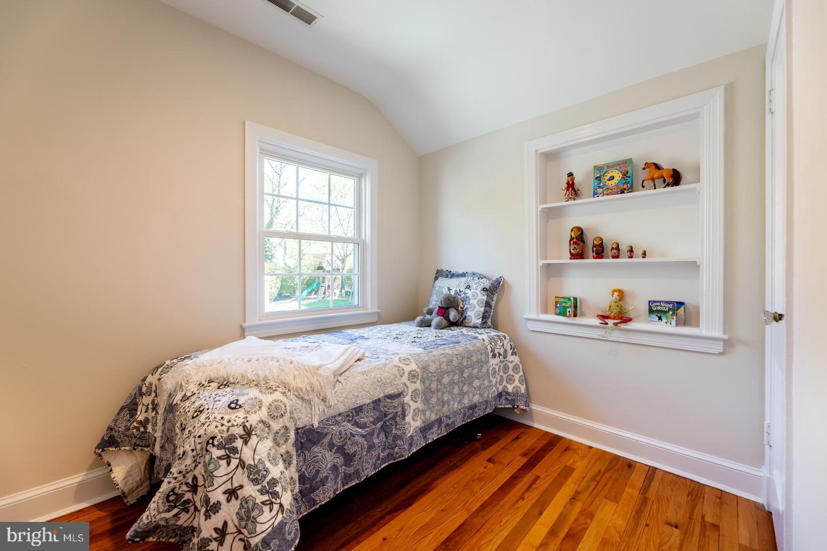 10009 Raynor Road Silver Spring, MD 20901 - Photo 19 of 34 a bedroom with a bed and a window