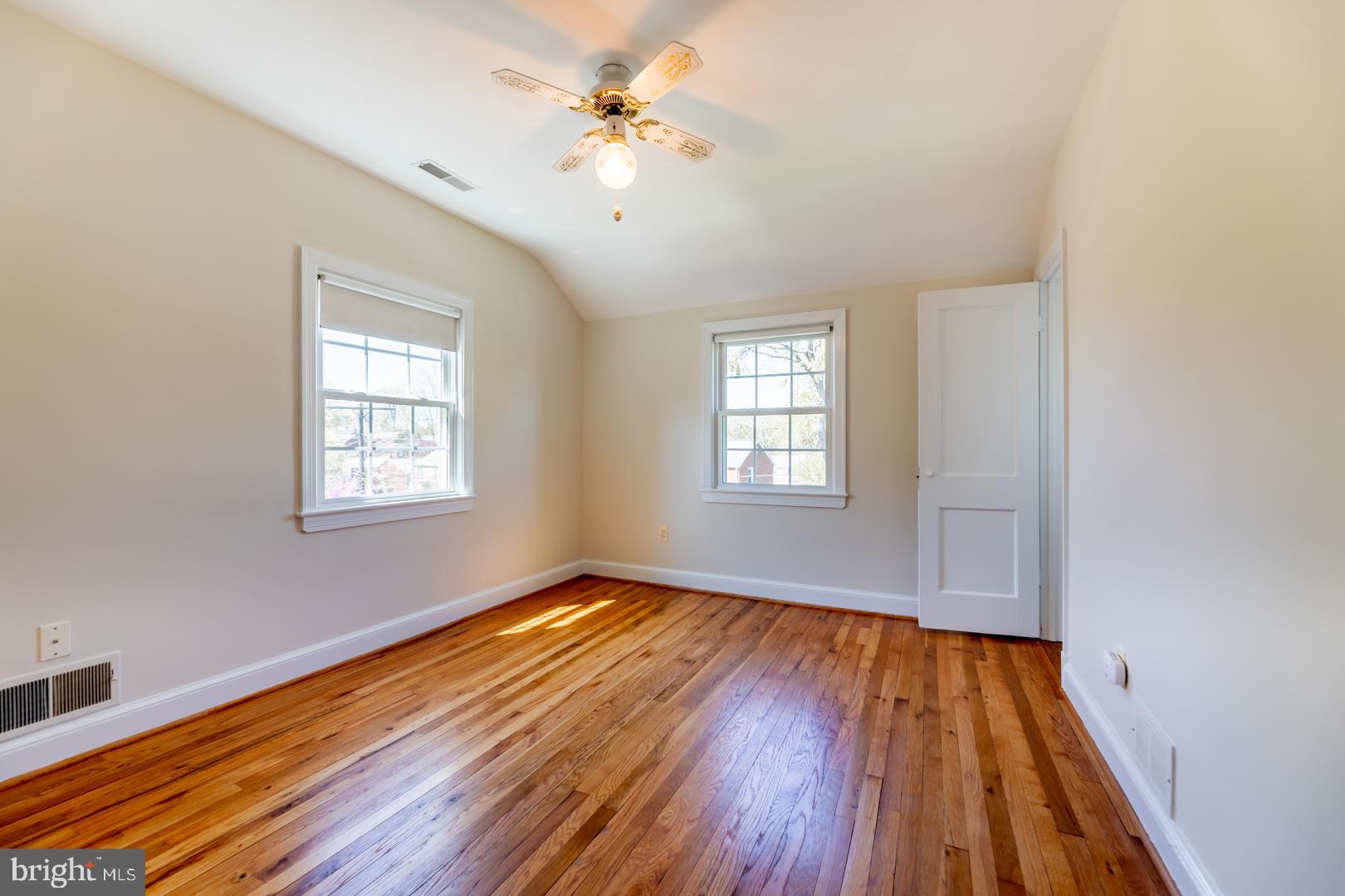 10009 Raynor Road Silver Spring, MD 20901 - Photo 21 of 34 wooden floor in an empty room with a window