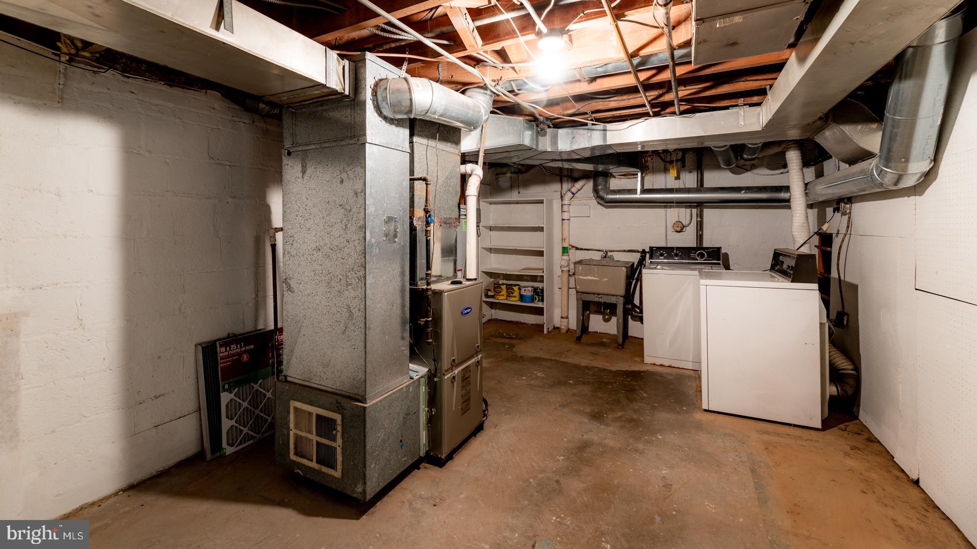 10009 Raynor Road Silver Spring, MD 20901 - Photo 24 of 34 a view of a storage & utility room with washer and dryer