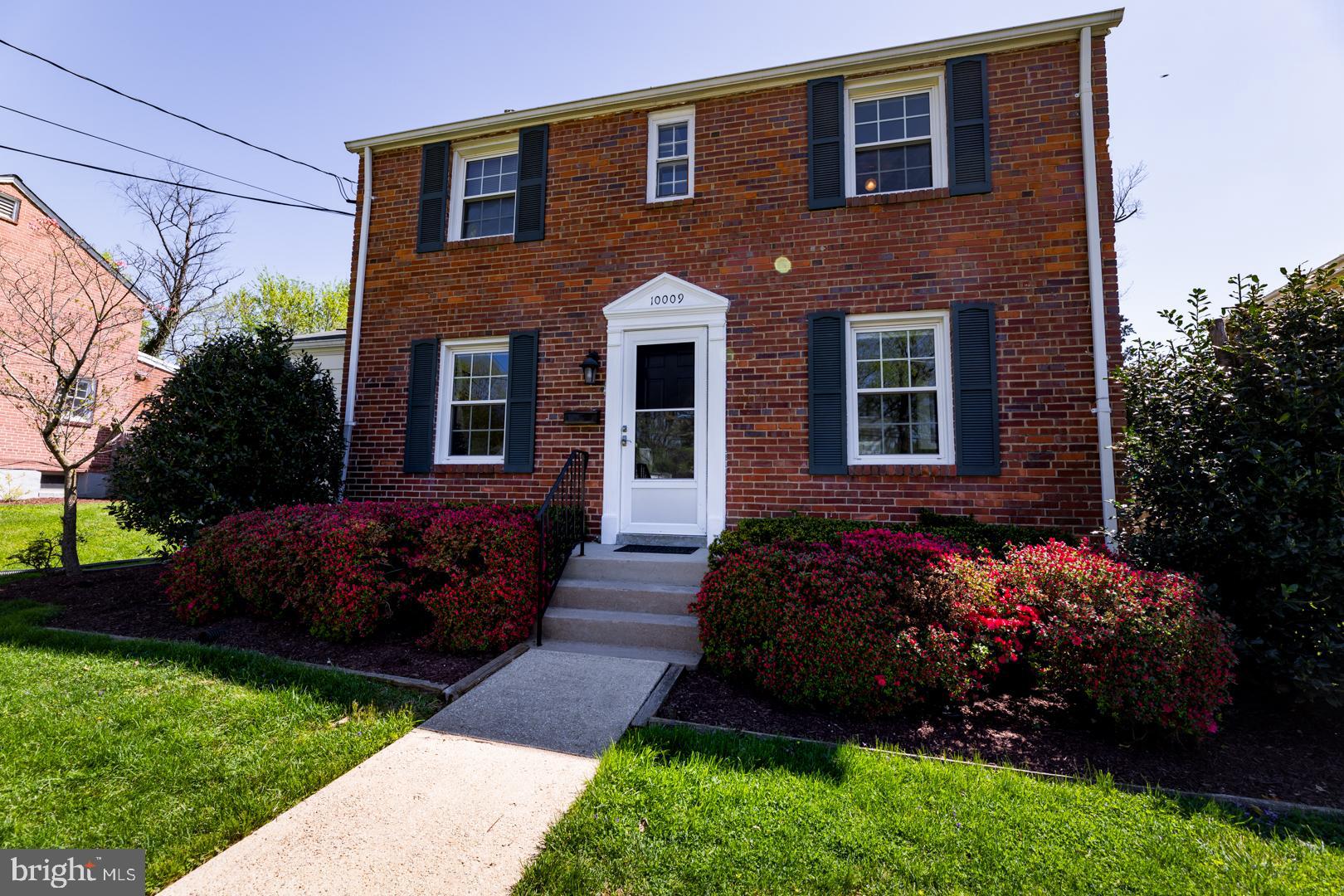 10009 Raynor Road Silver Spring, MD 20901 - Photo 32 of 34 a front view of a house with a garden