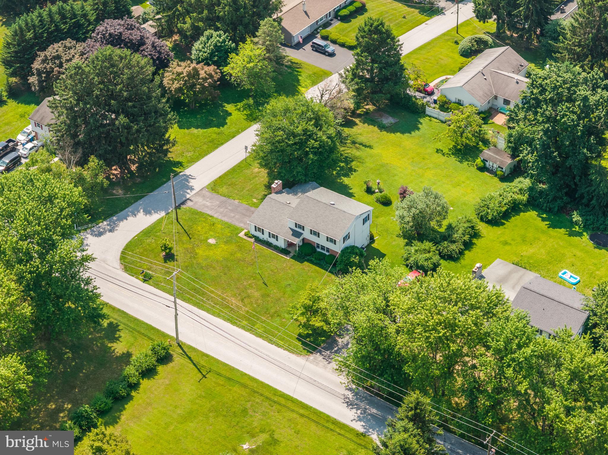258 Monacy Road Coatesville, PA 19320 - Photo 49 of 54 an aerial view of a house with swimming pool and large trees