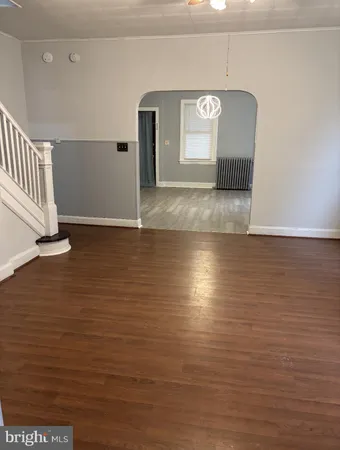 a view of a livingroom with wooden floor