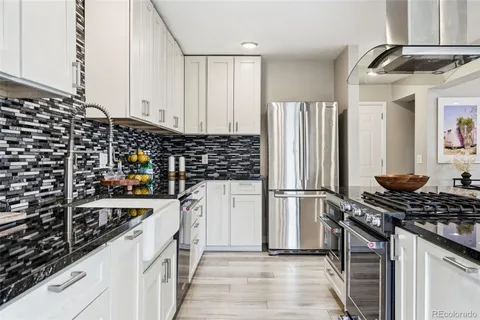 a kitchen with a stove and a refrigerator