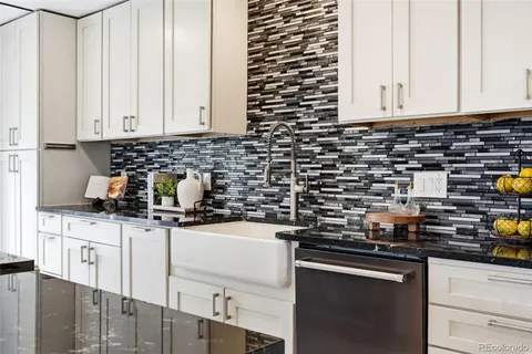 a kitchen with a sink and cabinets