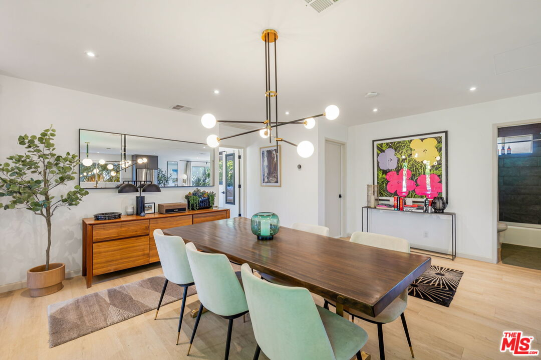 66869 San Ardo Road Desert Hot Springs, CA 92240 - Photo 9 of 39 a view of a dining room with furniture and wooden floor