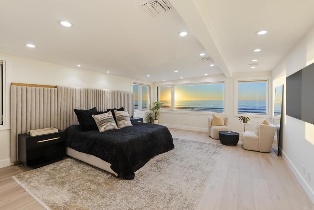 2016 Ocean Front Del Mar, CA 92014 - Photo 7 of 12 a living room with furniture and a large window