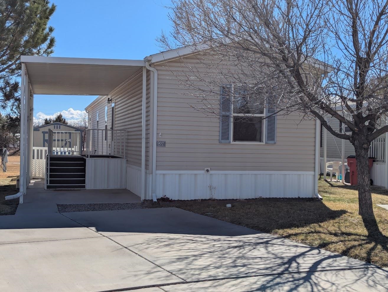 435 32 Road, Unit 907 Clifton, CO 81520 - Photo 1 of 24 a view of a house with a yard