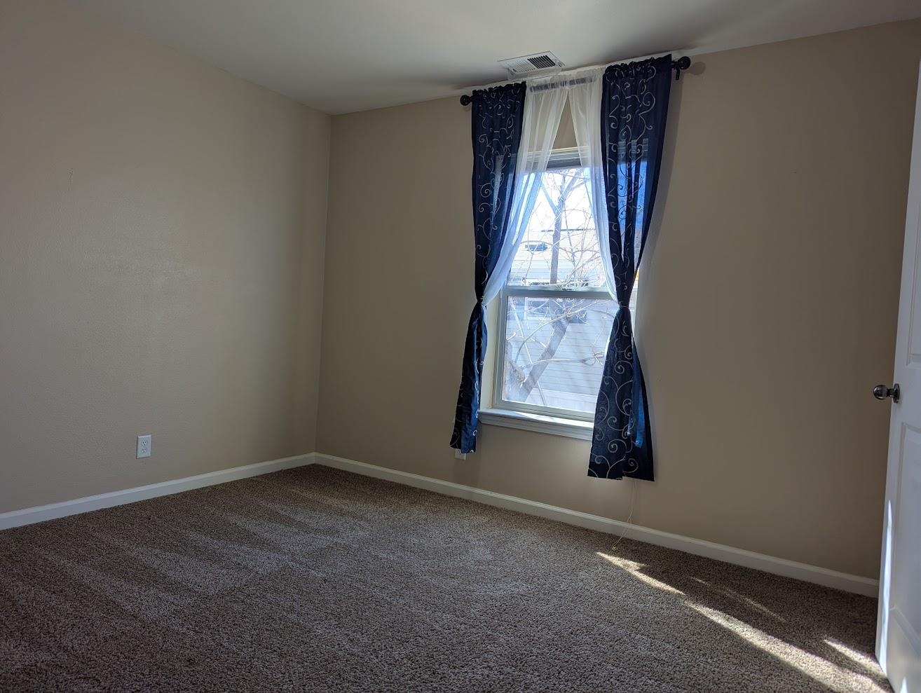 435 32 Road, Unit 907 Clifton, CO 81520 - Photo 13 of 24 an empty room with windows