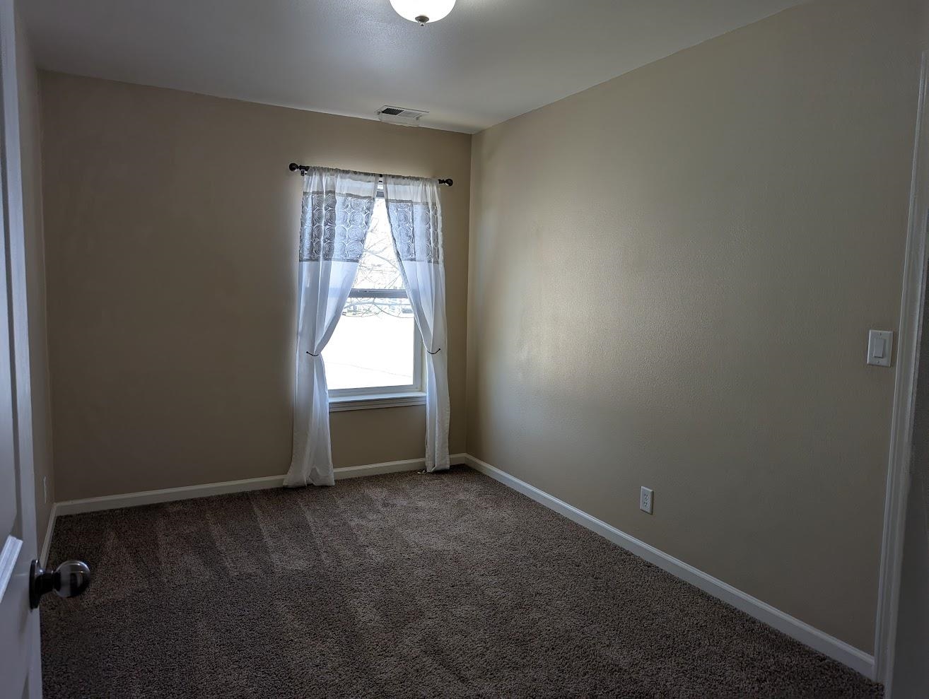 435 32 Road, Unit 907 Clifton, CO 81520 - Photo 18 of 24 an empty room with windows