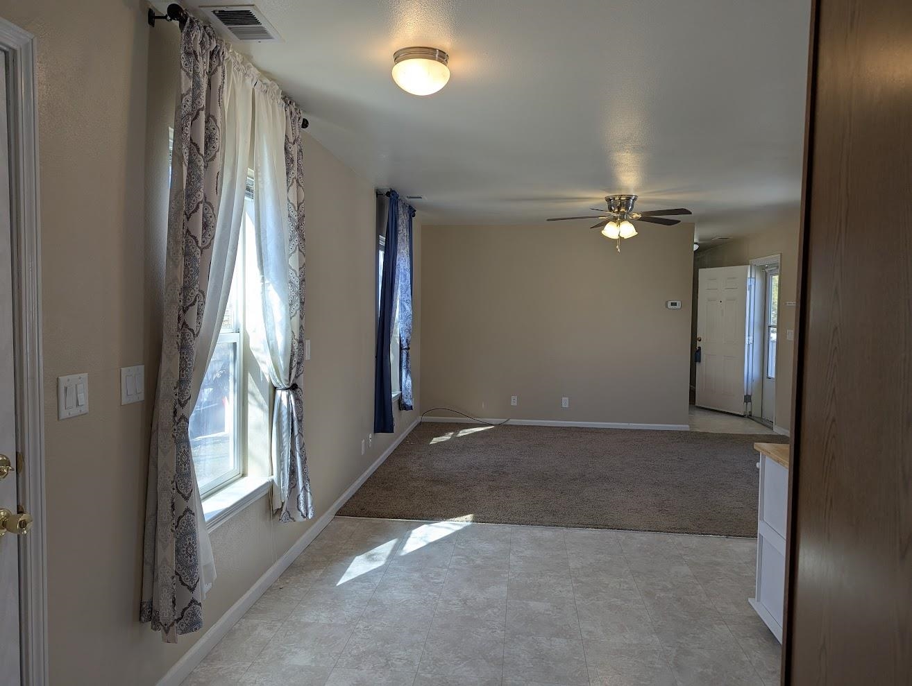 435 32 Road, Unit 907 Clifton, CO 81520 - Photo 20 of 24 a view of a livingroom with an empty space and a window