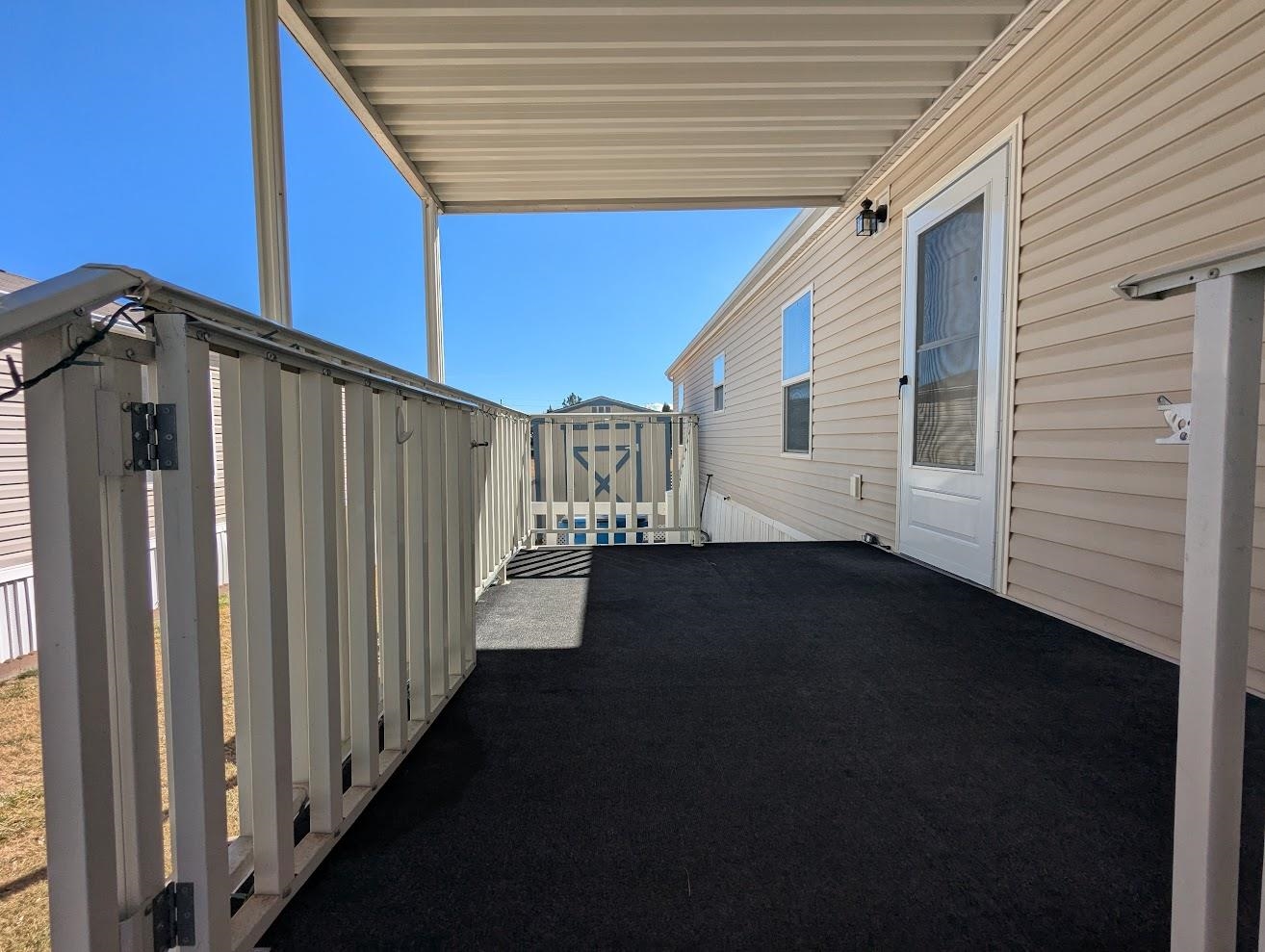 435 32 Road, Unit 907 Clifton, CO 81520 - Photo 22 of 24 a view of a house with a backyard