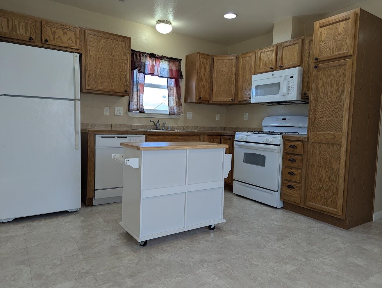 435 32 Road, Unit 907 Clifton, CO 81520 - Photo 3 of 24 a kitchen with stainless steel appliances granite countertop a refrigerator stove a sink and dishwasher