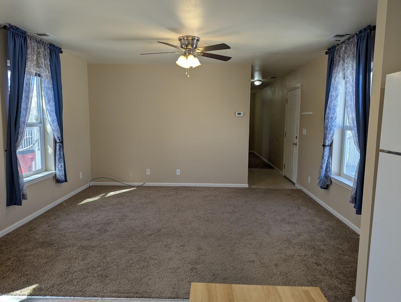 435 32 Road, Unit 907 Clifton, CO 81520 - Photo 6 of 24 an empty room with windows and fan