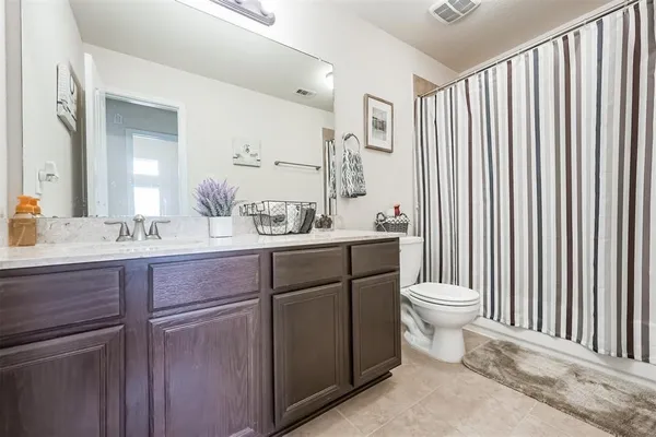 a bathroom with a sink a bathtub and a mirror
