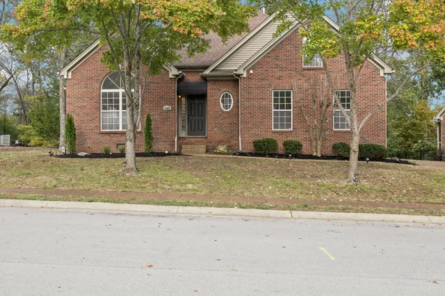 a front view of a house with a yard