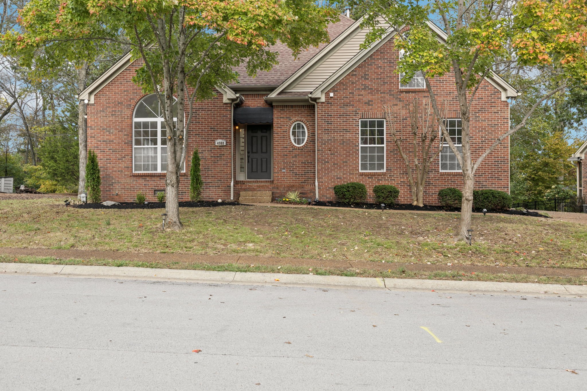 a front view of a house with a yard