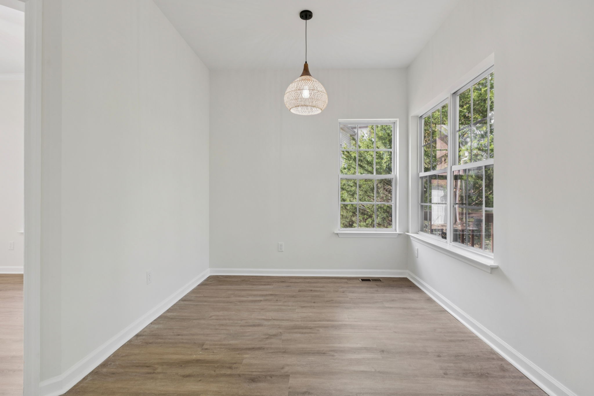 4909 John Hagar Road Hermitage, TN 37076 - Photo 21 of 67 a view of an empty room with wooden floor and a window