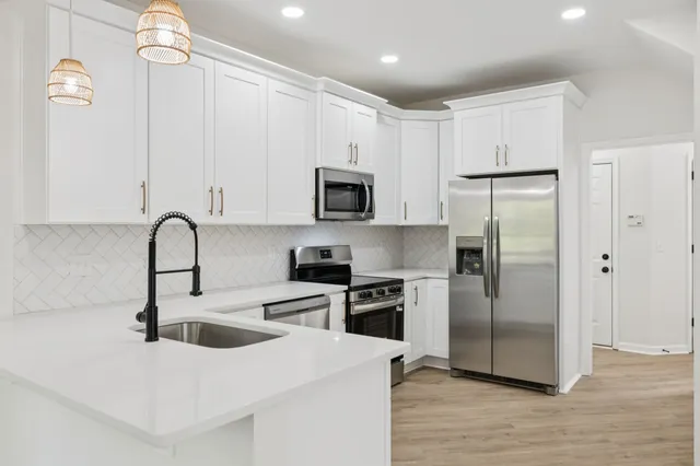 an empty room with a ceiling fan and window