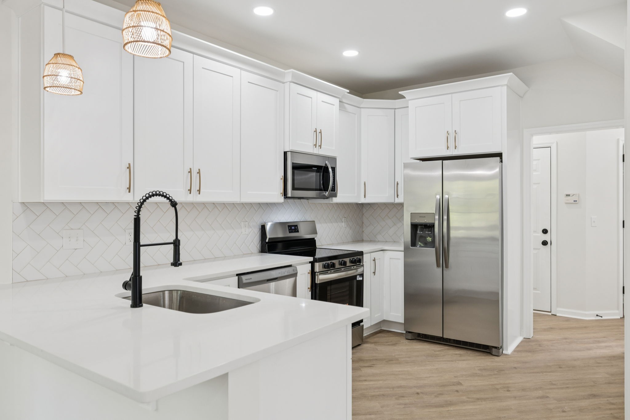 4909 John Hagar Road Hermitage, TN 37076 - Photo 24 of 67 a kitchen with stainless steel appliances granite countertop a refrigerator a sink a stove a microwave and island