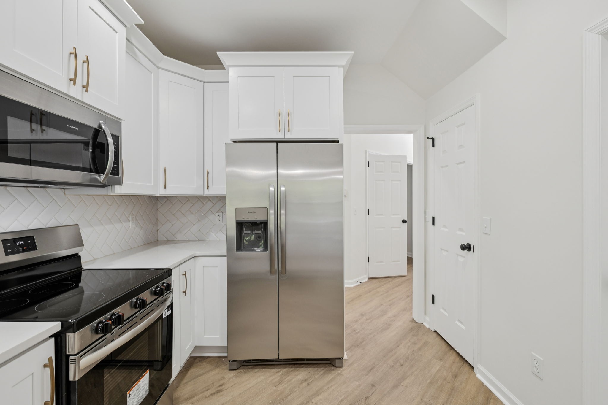 4909 John Hagar Road Hermitage, TN 37076 - Photo 30 of 67 a kitchen with stainless steel appliances a refrigerator stove and microwave
