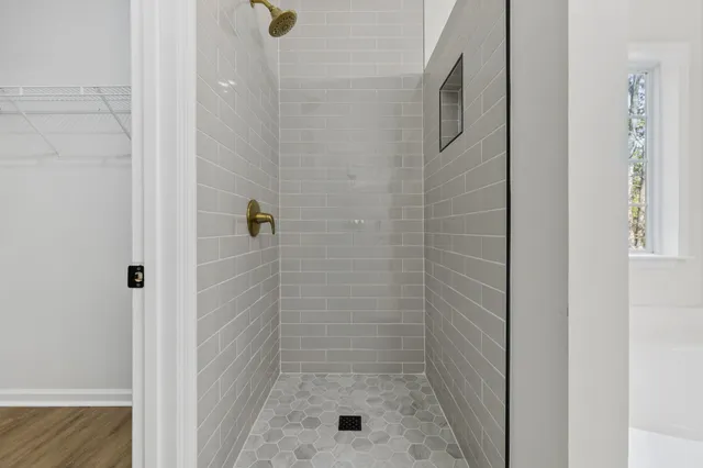 a view of balcony with wooden floor