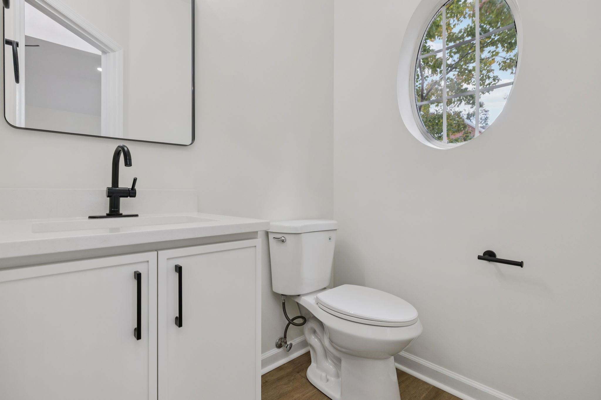 4909 John Hagar Road Hermitage, TN 37076 - Photo 52 of 67 a bathroom with a toilet sink and mirror