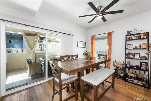 a kitchen with granite countertop a refrigerator and a sink