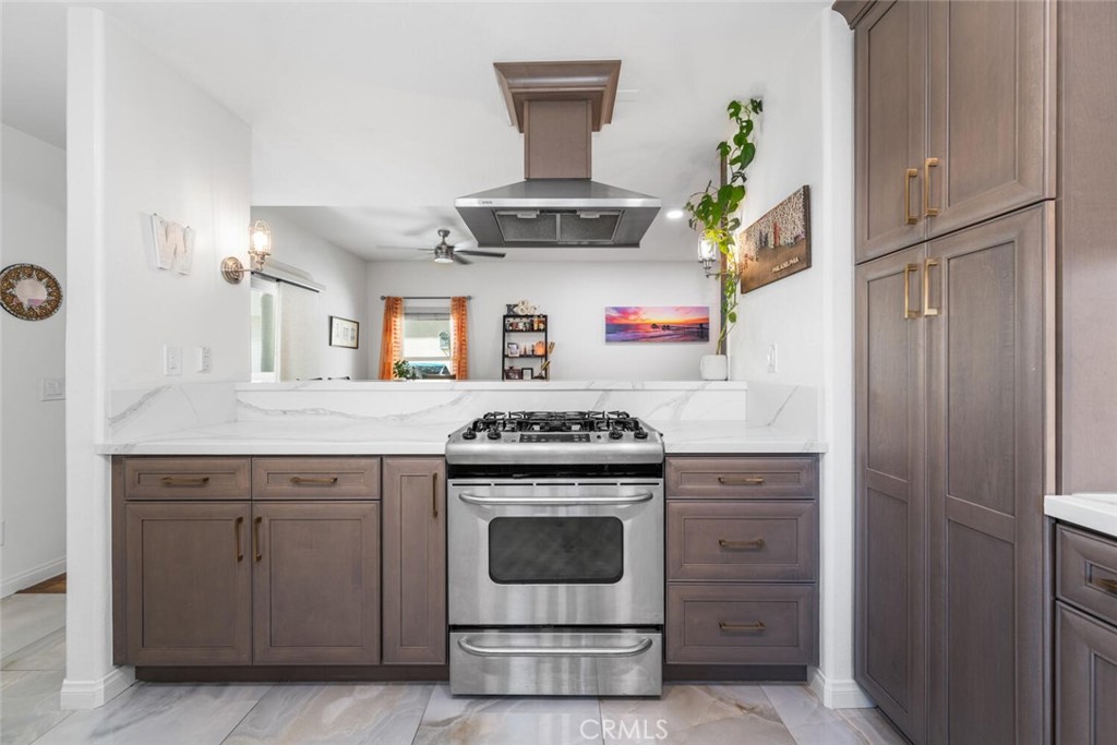 1516 Pacific Coast Highway, Unit 101 Huntington Beach, CA 92648 - Photo 19 of 58 a kitchen with a stove and cabinets