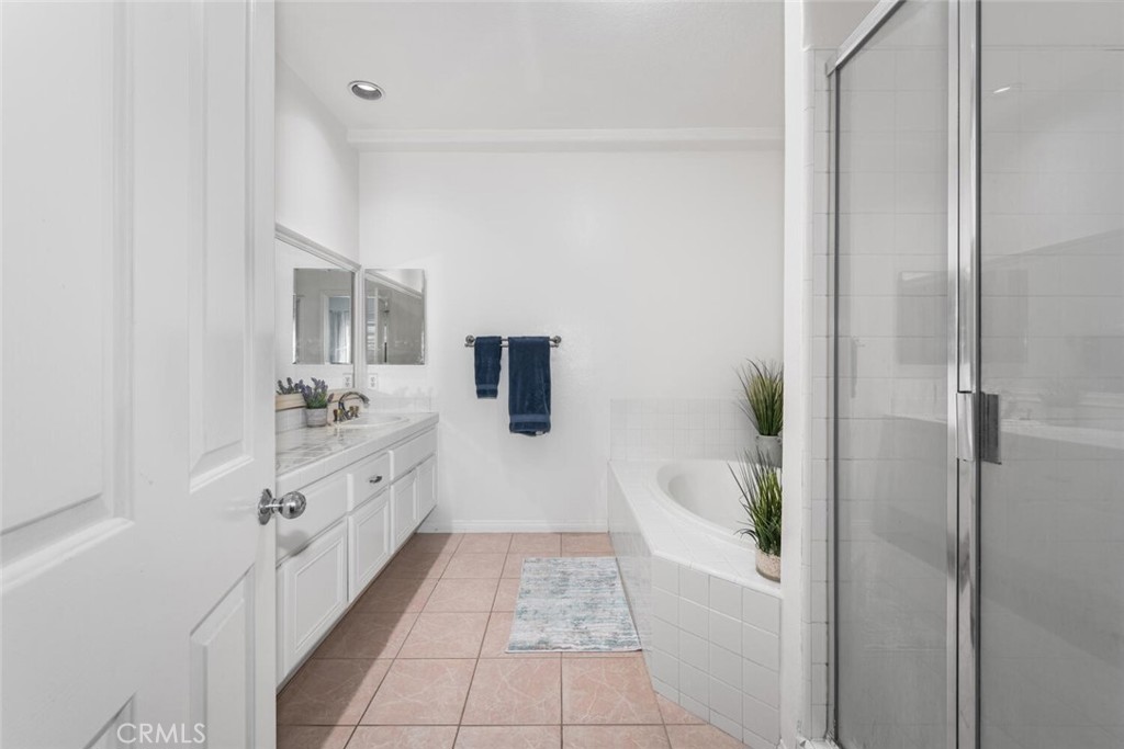 1516 Pacific Coast Highway, Unit 101 Huntington Beach, CA 92648 - Photo 24 of 58 a bathroom with a tub sink and mirror