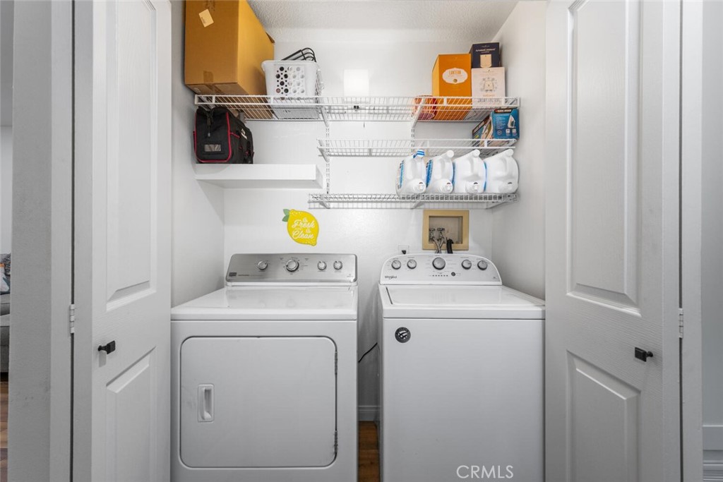 1516 Pacific Coast Highway, Unit 101 Huntington Beach, CA 92648 - Photo 34 of 58 a utility room with dryer and washer