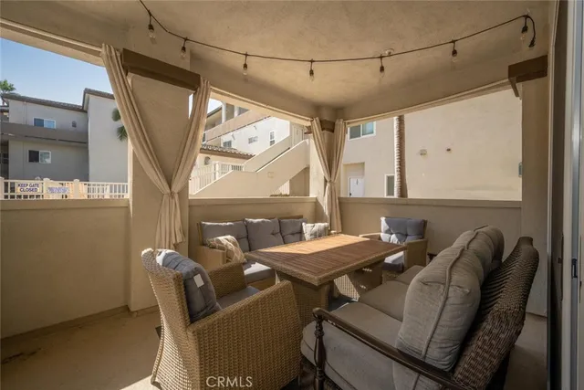 a view of a house with pool and chairs