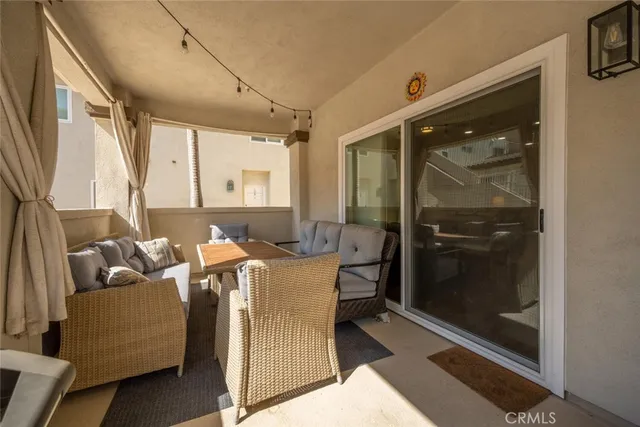 a view of a house with large windows