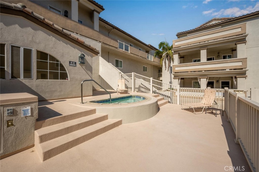 1516 Pacific Coast Highway, Unit 101 Huntington Beach, CA 92648 - Photo 42 of 58 a view of a house with large windows