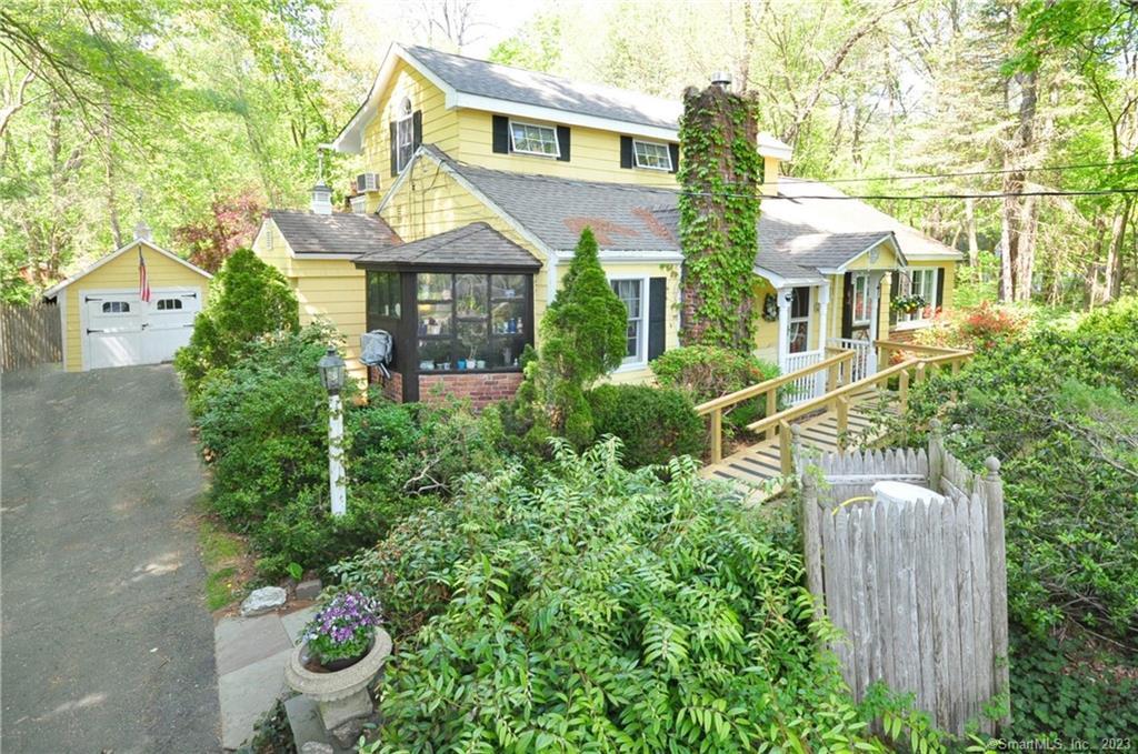 front view of a house with a garden
