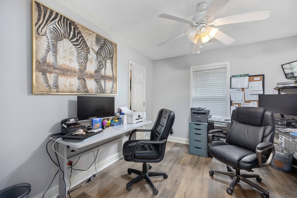 2083 Johnson Mill Road Hamilton, GA 31811 - Photo 18 of 54 a view of a workspace with furniture and a window