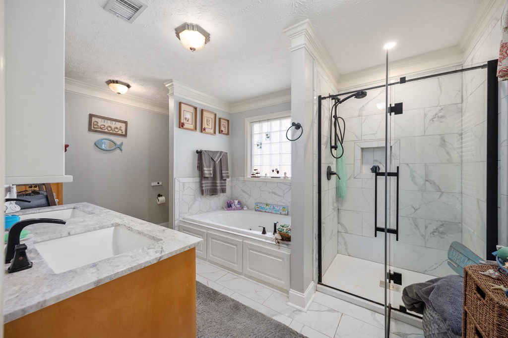 2083 Johnson Mill Road Hamilton, GA 31811 - Photo 24 of 54 a bathroom with a granite countertop sink mirror bathtub and shower